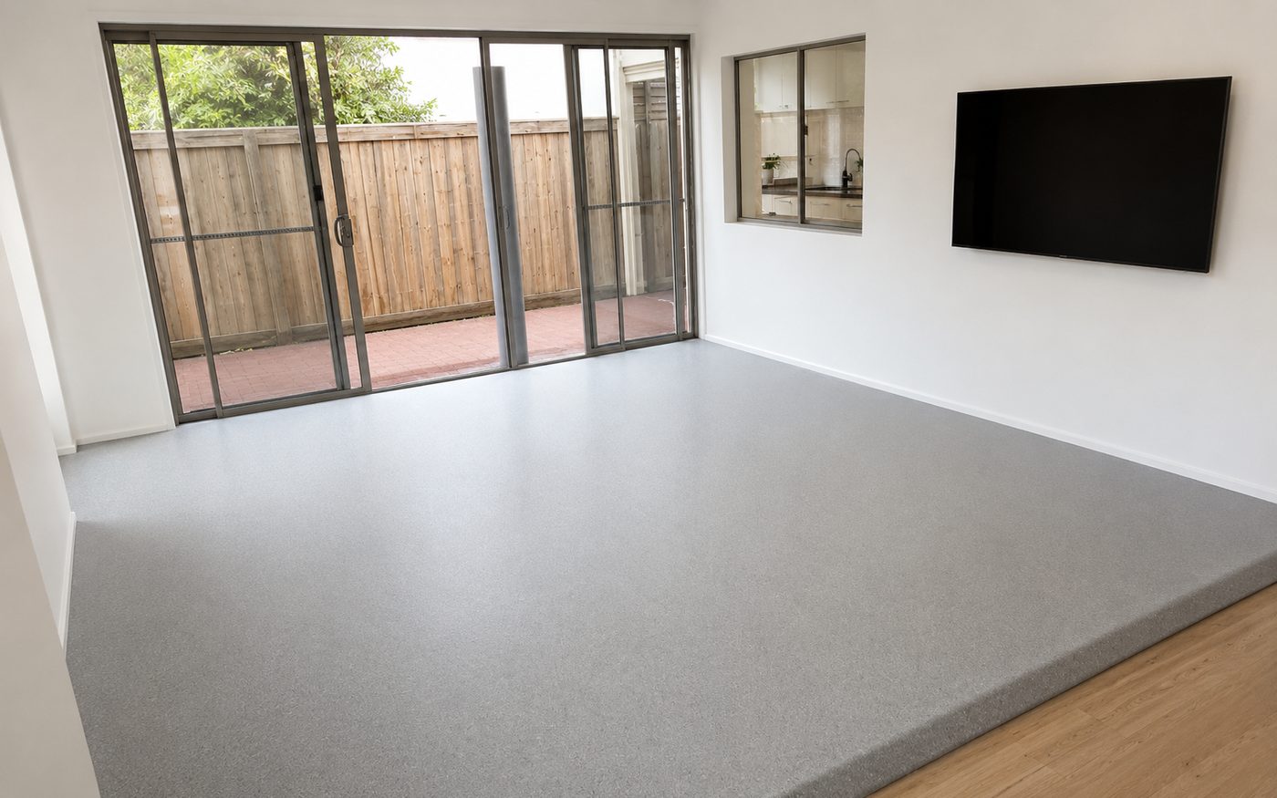 Home practice space with a compact grey vinyl sprung floor installed over the existing timber floor